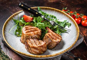 Grilled pork tenderloin sliced and seasoned with spices