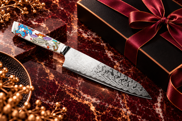Chef Supply Co knife on burgundy marble with copper accents.