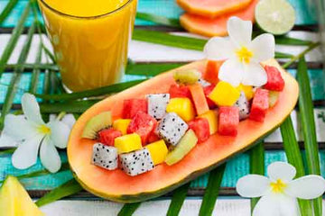 Tropical fruit salad served in a papaya bowl